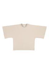 Tundra box shirt in sand laid flat to show its boxy shape and kimono style sleeves. Hálo from north