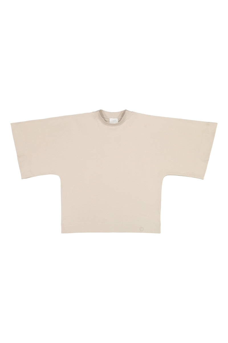 Tundra box shirt in sand laid flat to show its boxy shape and kimono style sleeves. Hálo from north