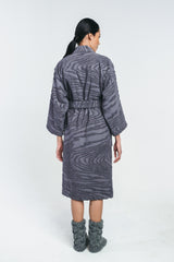 Kaarna bathrobe from behind. Worn by a model with matching grey wool socks, Hálo from north