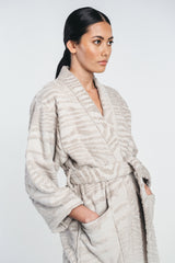 Kaarna bathrobe in sand worn by a model. Close up picture. Hálo from north