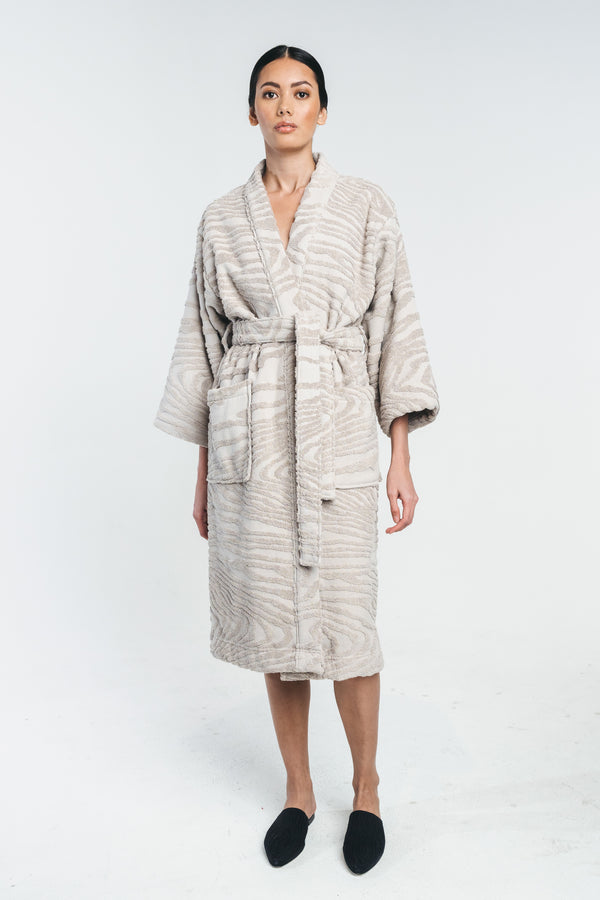 Kaarna bathrobe in sand worn by a model. Matched with kaarna slippers. Hálo from north