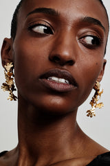 Tundra earrings 2-piece in bronze worn by a model. Exclusive Kalevala x Hálo collaboration. Hálo from north