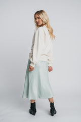 Neva woolen college in off white paired with kajo slip skirt. Back picture of the product. Hálo from north