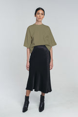 Tundra box shirt in pine green paired with kajo slip skirt in black. Hálo from north