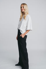 Tundra box shirt in white paired with kaarna wide pants. in black  Side picture, Hálo from north